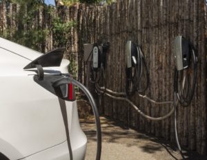 Tesla at EV charging station